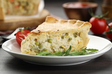 Piece of delicious fresh homemade pie served on wooden table, closeup