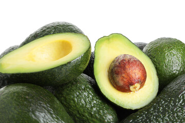 Many whole and cut avocados isolated on white