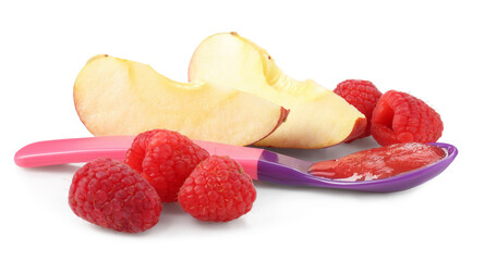Baby food. Tasty puree in spoon, apple and raspberries isolated on white