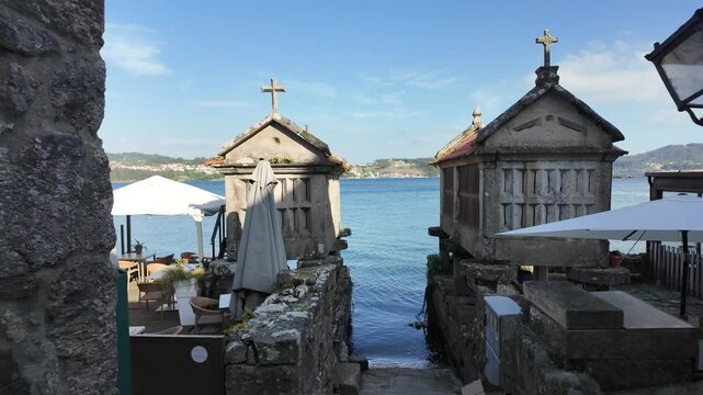 Combarro, horreos and stone crosses overlooking peaceful water in galicia, spain