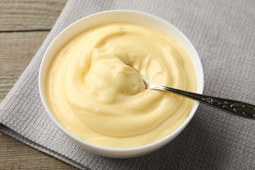 Tasty vanilla pudding served on wooden table, closeup