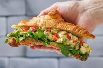 tasty egg avocado bell pepper croissant sandwich