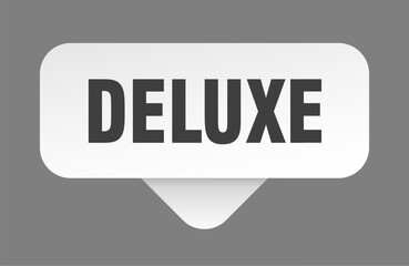 deluxe sticker. deluxe sign isolated on gray background