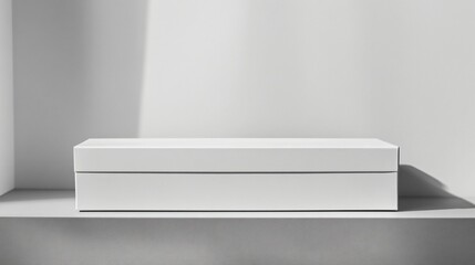 Minimalist white rectangular product box on a neutral background for clean packaging design mockup.