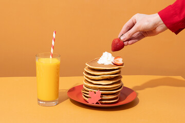 Canada Day traditional food concept. A girl in a classy cafe eats in Canada. Breakfast and lunch.