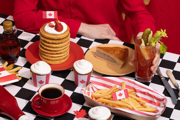 Canada Day traditional food concept. A girl in a classy cafe eats in Canada. Breakfast and lunch.