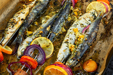 Baked sardines skewers.