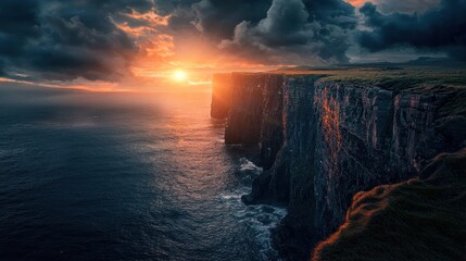Dramatic sunset over coastal cliffs and ocean. (1)