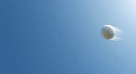 Golf ball flying through the air against a blue sky  