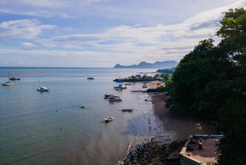 Beautiful view from above of boats moored on the beach in Dili City, the capital of Timor Leste. Dili is a city with beaches and surrounded by mountains.