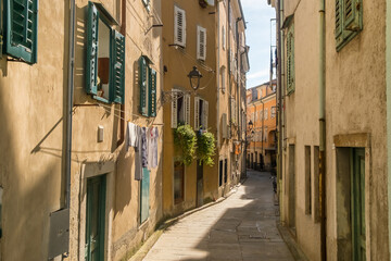 Picturesque narrow streets of the Muggia old town, Trieste, Italy