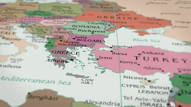 The camera rotating around Greece on the world map takes the focus.  4K Map Animation.