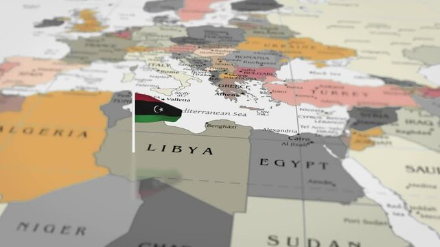 The camera rotating around libya on the world map takes the focus. libya flag waving on the map 4K Animation.