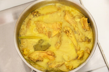 Opor Ayam, Indonesian traditional food, made from chicken cooked with coconut milk and spices. Popular during Eid al Fitr. 
