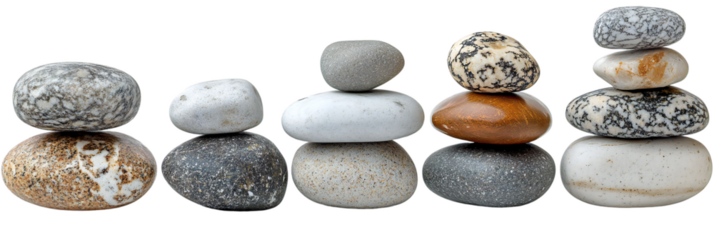 Perfectly balanced stacks of smooth multicolored pebbles in zen formation, natural stone arrangement isolated on transparent background