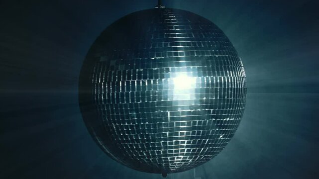 Disco mirror ball illuminates the background of a nightclub. A party is illuminated by a disco ball. Party and celebration concept.