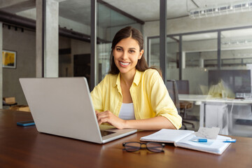Portrait at camera smiling latin female studying student, professional it specialist working at...