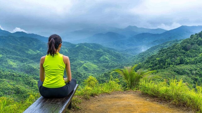 A runner resting on a bench at the end of a long trail, catching breath and rehydrating