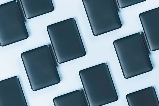 External hard drives on blue background.