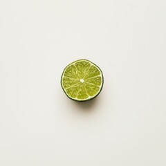 A single lime in close-up, isolated on a white background. Featuring smooth skin and bright green color