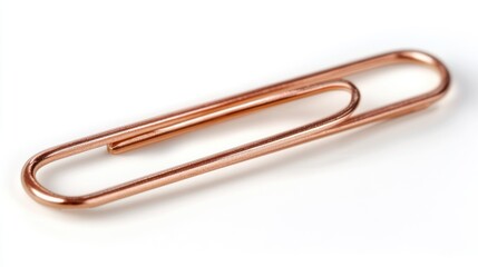 Obraz premium Rose gold paperclip, white background, close-up