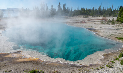 Steaming Geothermal Abyss pool in Yellowstone Park. Wyoming, USA