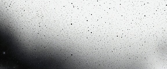 Obraz premium Gradient background transitions from dark gray to light gray, covered with randomly distributed black speckles of varying sizes in an abstract design.