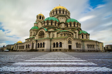 St. Alexander Nevsky Cathedral in Sofia, Bulgaria, with a pedestrian crossing in the foreground