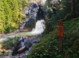 waterfall long exposure river flow good light in the alps