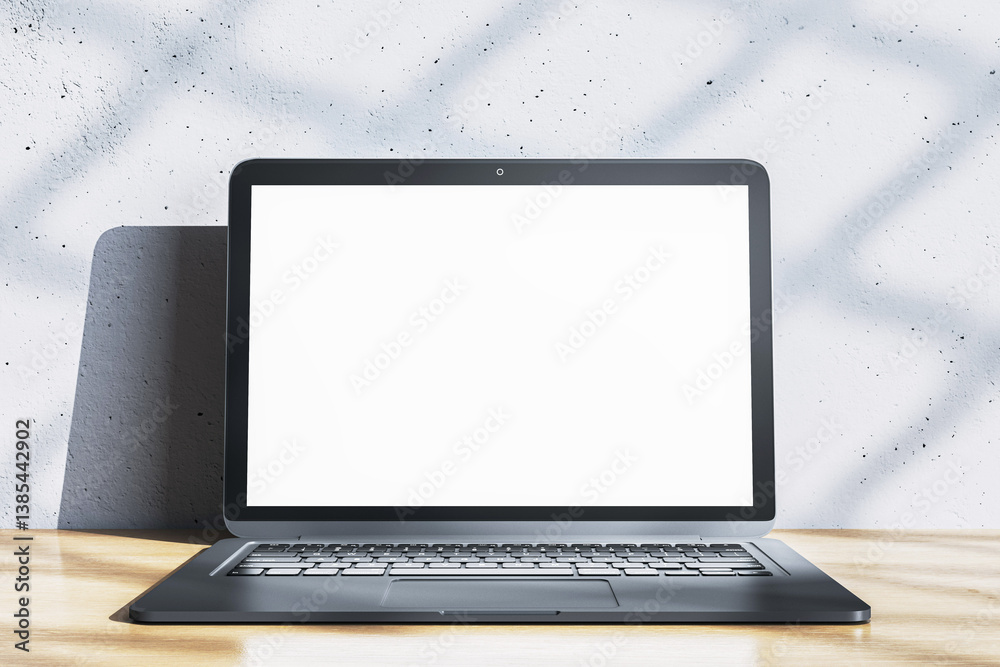 Poster blank laptop screen mockup on wooden desk against textured white wall with shadow pattern, for moder