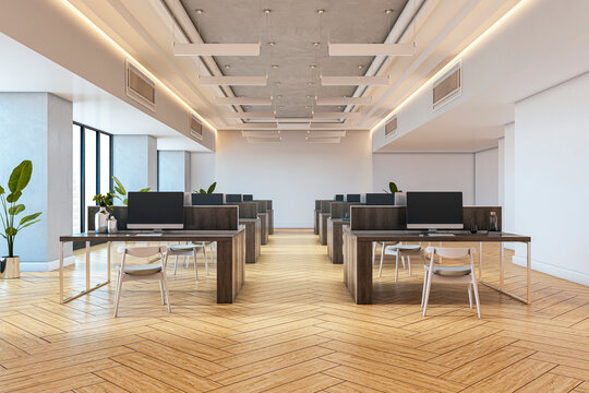Modern open-plan office interior with wooden floors, minimalist furniture, and computer desks in a clean architectural space with natural light. 3D Rendering