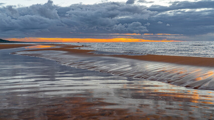 Baltic coastal landscape with sand sulfur on a summer evening