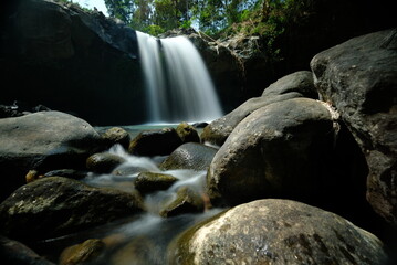 Curug Panglebur Gongso in Limbangan Central Java. Waterfall in natural forest. Waterfall with natural clear water