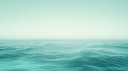 Fototapeta premium A serene ocean view with a calming gradient background transitioning from mint green to white