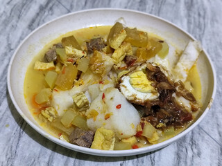 Ketupat Lebaran. Chicken vegetable ketupat is a typical Indonesian dish that is famous for its deliciousness and has a special place in Indonesian culinary culture