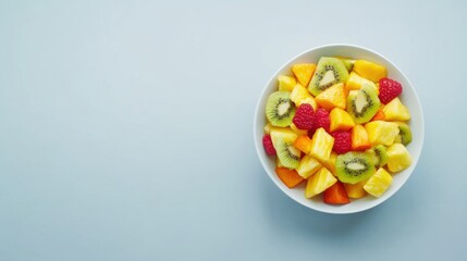 A vibrant fruit salad with pineapple, mango, and kiwi. Featuring freshness and color