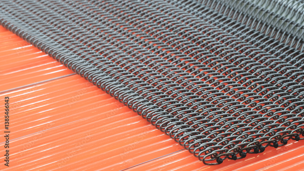 Poster a close up of a chain link fence with a red background. the fence is made of metal and has a lot of 