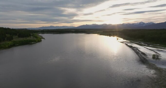 Zoom out aerial shot of Laguna La Zeta, Natural Reserve at sunset. Esquel, Chubut, Patagonia Argentina