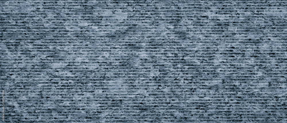 Poster a blue and gray striped wall with a rough texture. the wall is made of stone and has a very textured