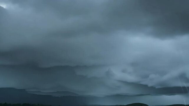 A Stormy Sky: Captivating image of a dark, dramatic sky filled with ominous, rain-laden clouds, conveying the power and raw beauty of nature's atmospheric display.