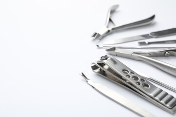 Set of different manicure tools on white background, closeup. Space for text