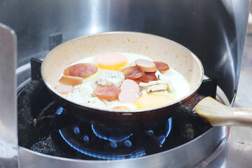 Fried eggs with condiments at a restaurant