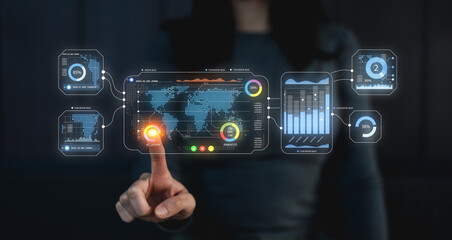 A futuristic interface displays data visualizations, charts, and global maps, with a hand interacting by touching the screen, suggesting advanced technology use.