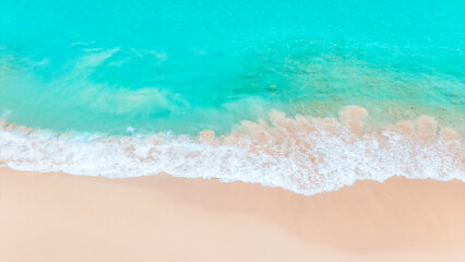 Sunny tropical beach with clear waves and smooth white sand coast. summer background and summer holiday concept.