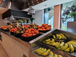 Delicious variety of diverse fruits at a fruit bar at a self service buffet restaurant in a luxury hotel