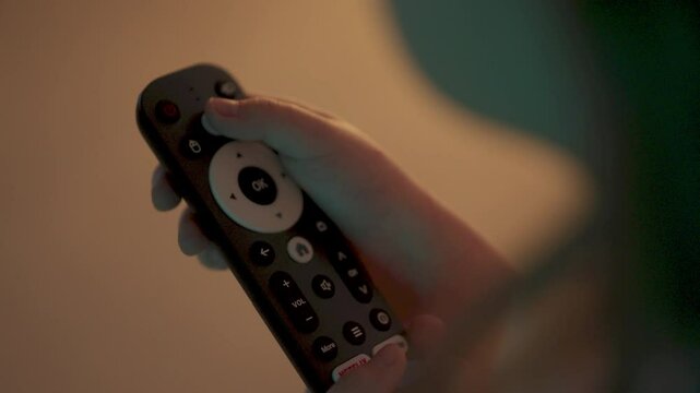TV remote control in hands. technologies. TV remote control