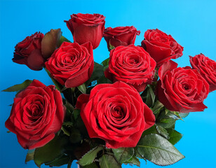 Obraz premium bouquet of red roses is placed on a blue background copy space