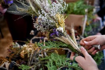 The process of making traditional Lithuanian Easter palm, using dried flowers and branches