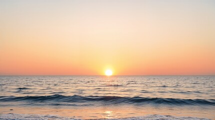 Obraz premium Tranquil sunset over serene ocean waves at the beach 