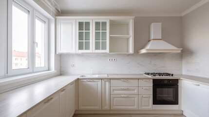 Fototapeta premium Bright kitchen interior with white cabinets and appliances under a large window light filled space